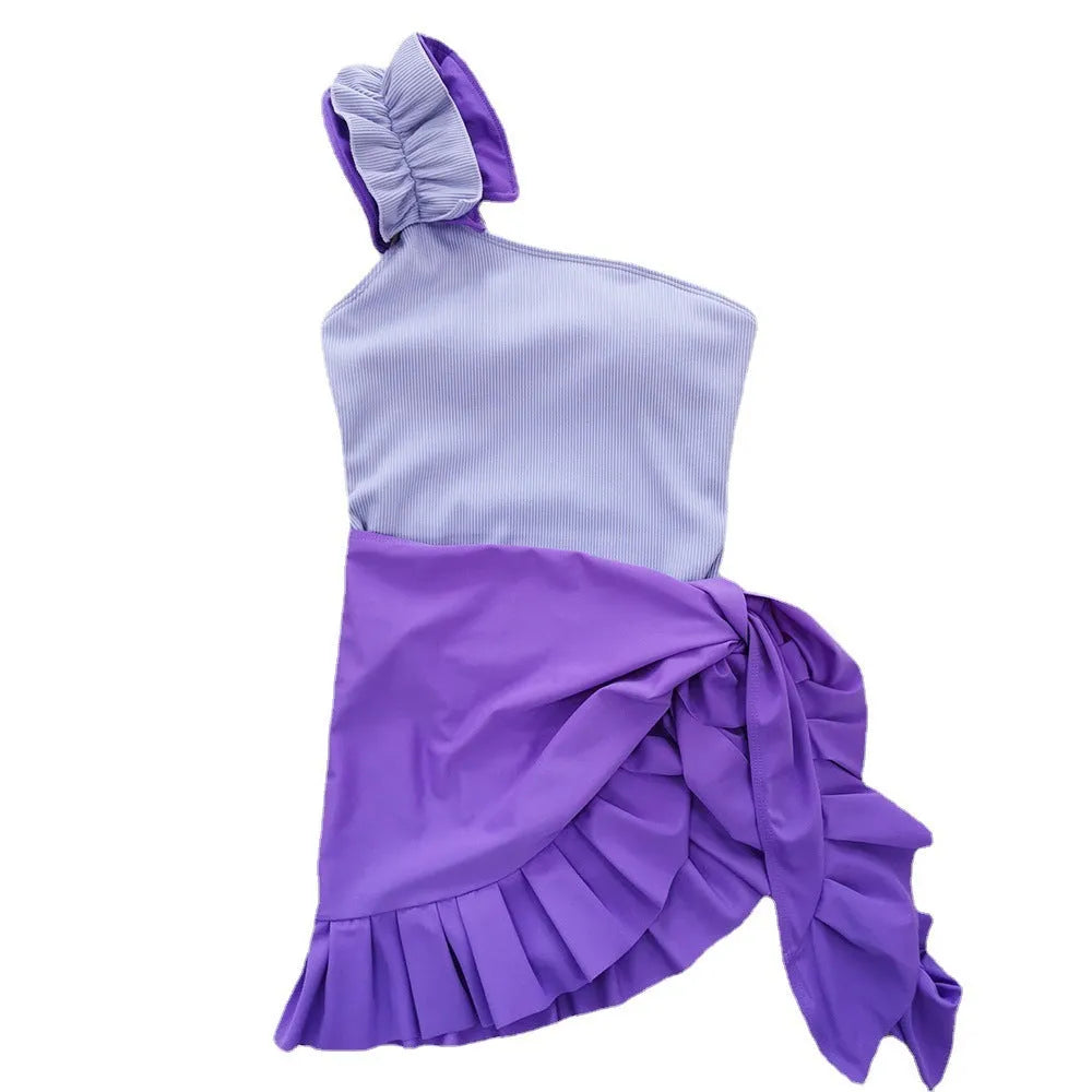 Women's single-shoulder suspender tube top one-piece swimsuit in a high-waist design on a model.