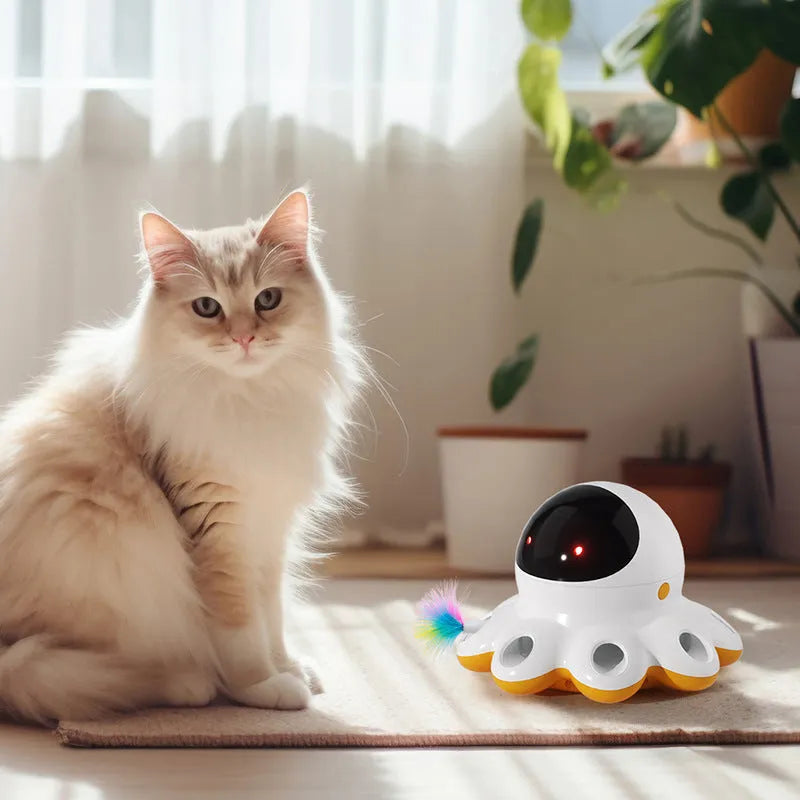 Automatic electric cat teaser toy with colourful feather attachment on a plastic base