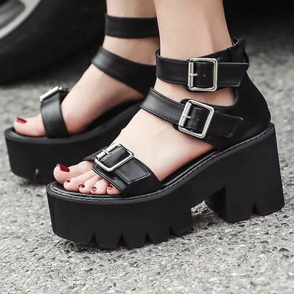 Black punk-style women's sandals with a chunky heel, thick platform sole, round toe, buckle strap, and back zipper.