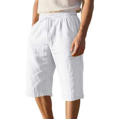 Men's loose-fit linen shorts in a solid colour with a drawstring waist and cropped leg length.