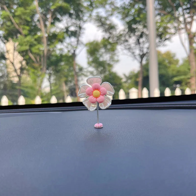 Small plastic car decoration swing measuring 5cm tall in blue, green, pink, purple, and yellow colour options