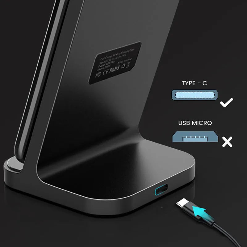 Dark grey vertical aluminium wireless charging stand for iPhone on a desk