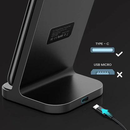 Dark grey vertical aluminium wireless charging stand for iPhone on a desk