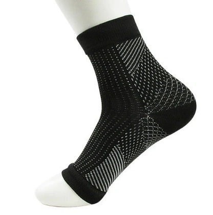 Anti-fatigue compression foot sleeve in black, red, or white, featuring moisture-wicking fabric and a heel hole for breathability.