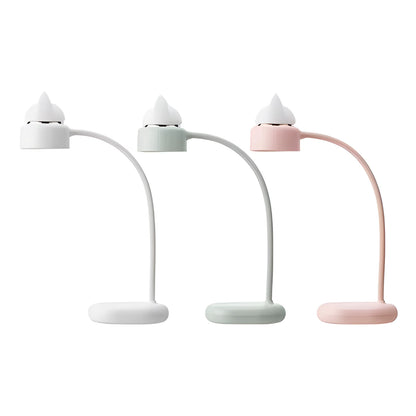 White clip-on LED desk lamp with built-in battery attached to a desk edge.