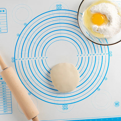 40x60cm black silicone baking mat with measurement guides on kitchen counter