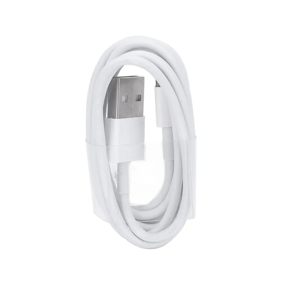 White USB travel charger with UK plug and a coiled Lightning cable for iPhone and iPad charging