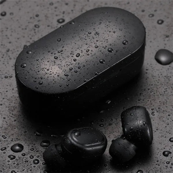 Black and white M1 wireless Bluetooth earbuds with a charging case on a neutral background.