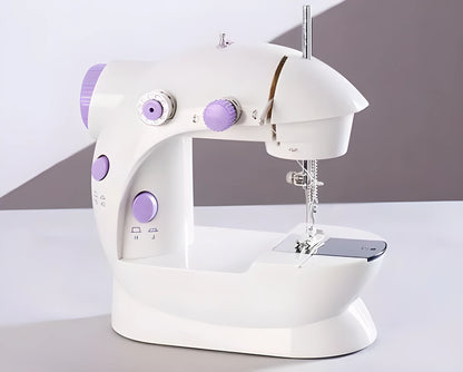 Compact white mini electric household sewing machine with work light and thread cutter.