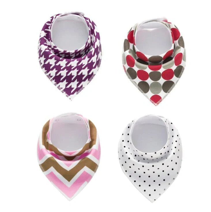 Set of four cotton baby bibs with arrow and wave designs for mess-free feeding