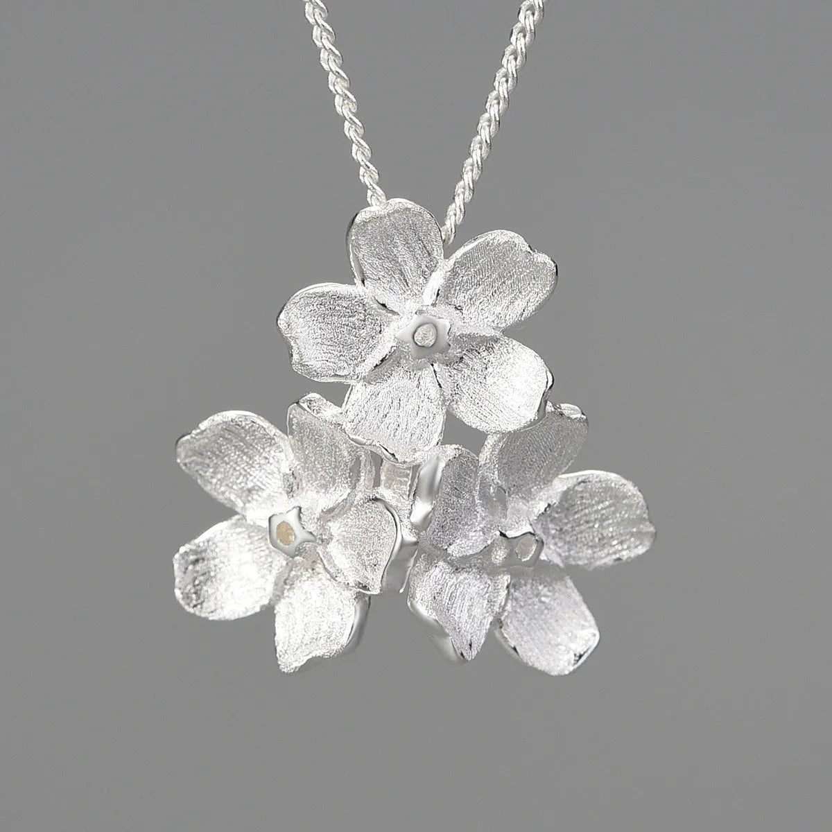 Myosotis Sylvatica sterling silver floral pendant with open mouth design in pastoral style