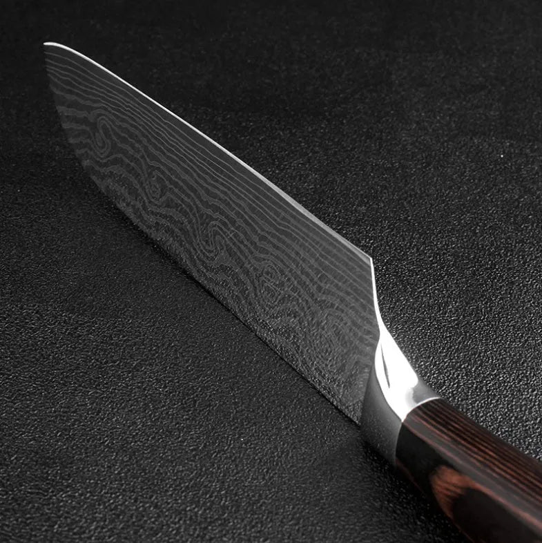7-inch chef knife with laser Damascus pattern on blade and coloured steel handle on a cutting board.