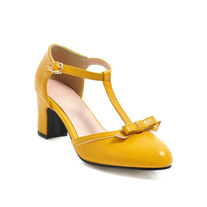 Women's apricot chunky heel sandals with bow tie, hollow-out detail, and an adjustable buckle strap.