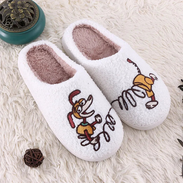 White fluffy cartoon-pattern slippers with a rubber sole and artificial wool lining.