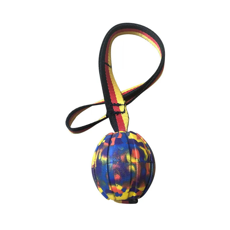 Yellow and camouflage coloured EVA foam floating dog balls with strings in 6.5cm, 7cm, and 9cm sizes.
