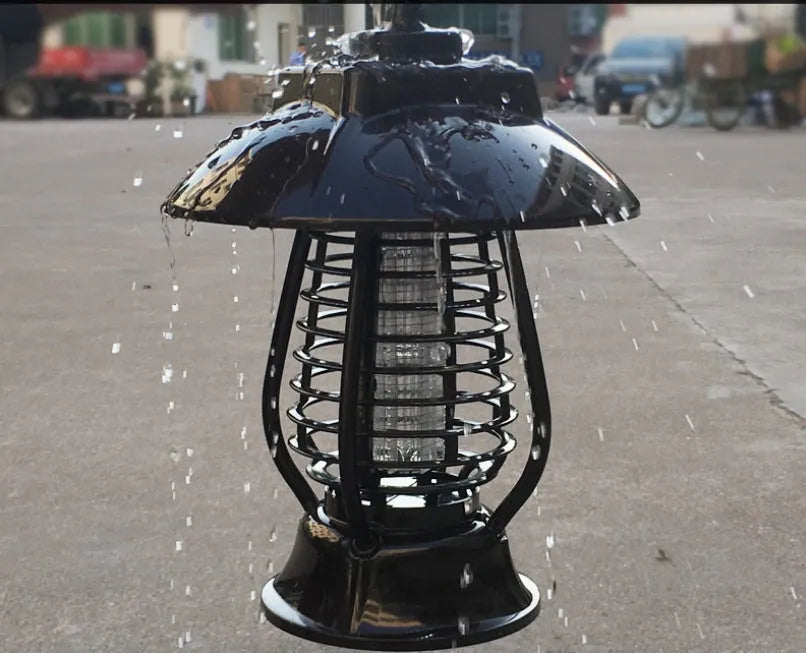 White solar mosquito lamp for outdoor garden use with solar panel and LED lights.