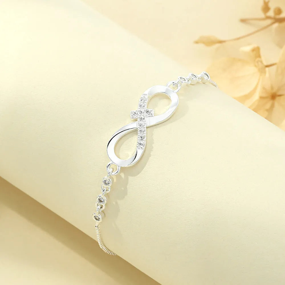Diamond studded pull-out bracelet with infinite 8-shaped design, copper plastic, 26cm circumference, 20.0mm x 8.0mm