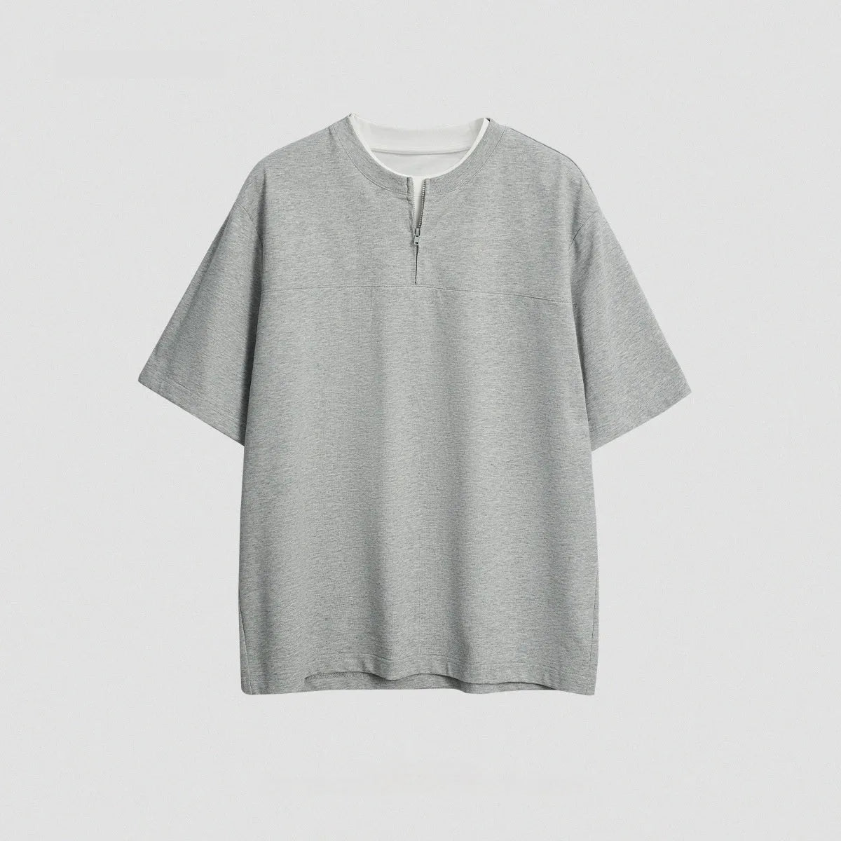 Solid colour loose fit cotton blend pullover top with patchwork collage detailing on a model.