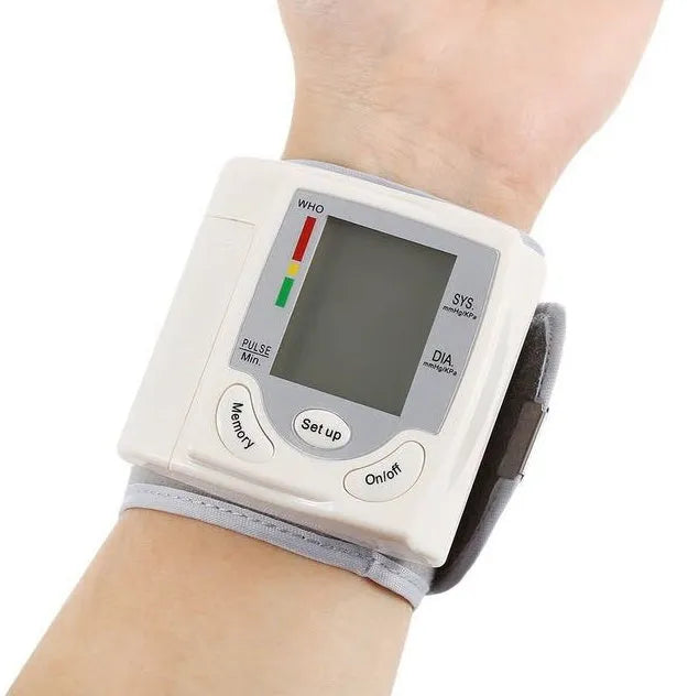 Grey portable wrist blood pressure monitor with digital display and ABS plastic casing