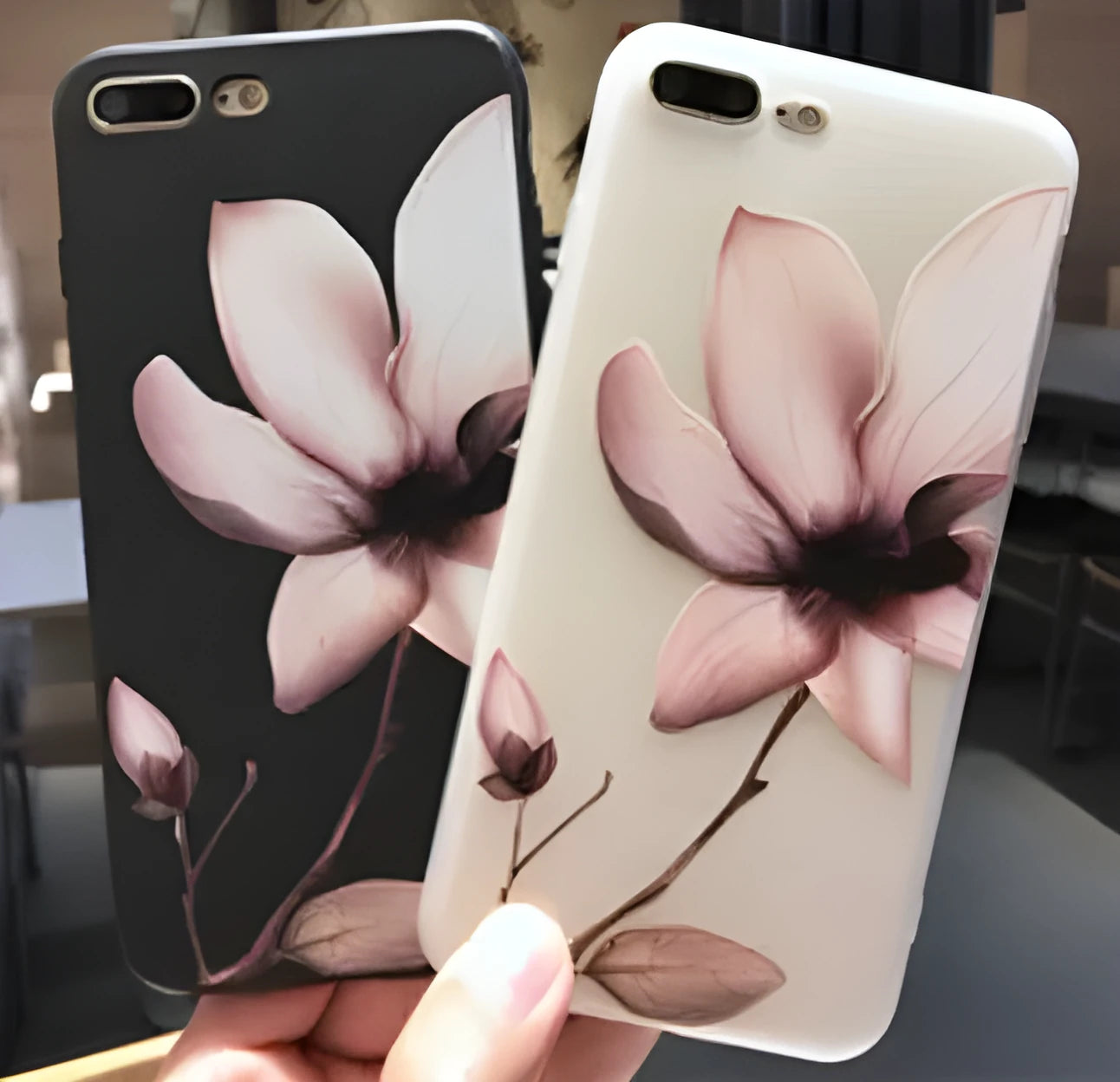 Embossed floral TPU phone case in black and white colour options showing floral pattern detail.