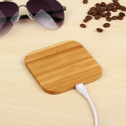 Square wooden bamboo 5W Qi wireless charger on a desk