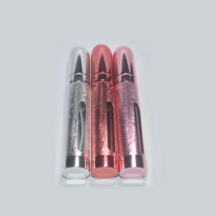 Slim 12ml aluminium travel perfume bottle with glass liner in bullet shape, shown in various colours.