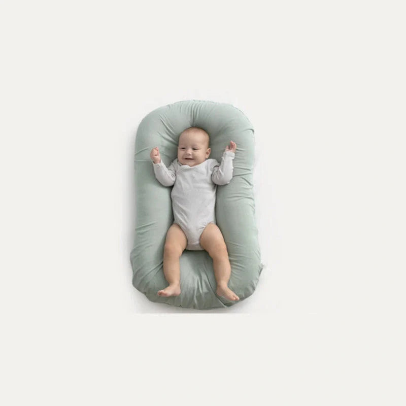 Portable baby nest crib in various colours, perfect for newborns to 3 years