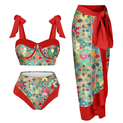 Women's pink and floral print split swimsuit three-piece set with skirt, bra, and panties.