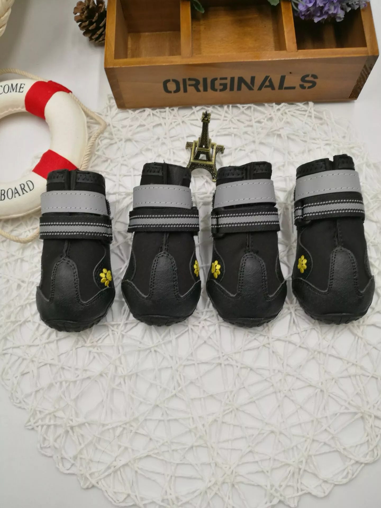 Black waterproof dog shoes with non-slip soles and adjustable fuzzy belt