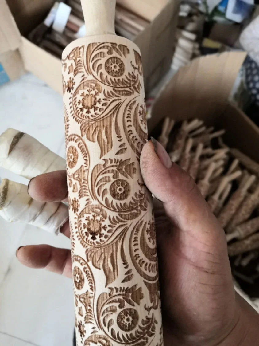 Festive rolling pin with embossed Christmas designs for easy imprinting on dough