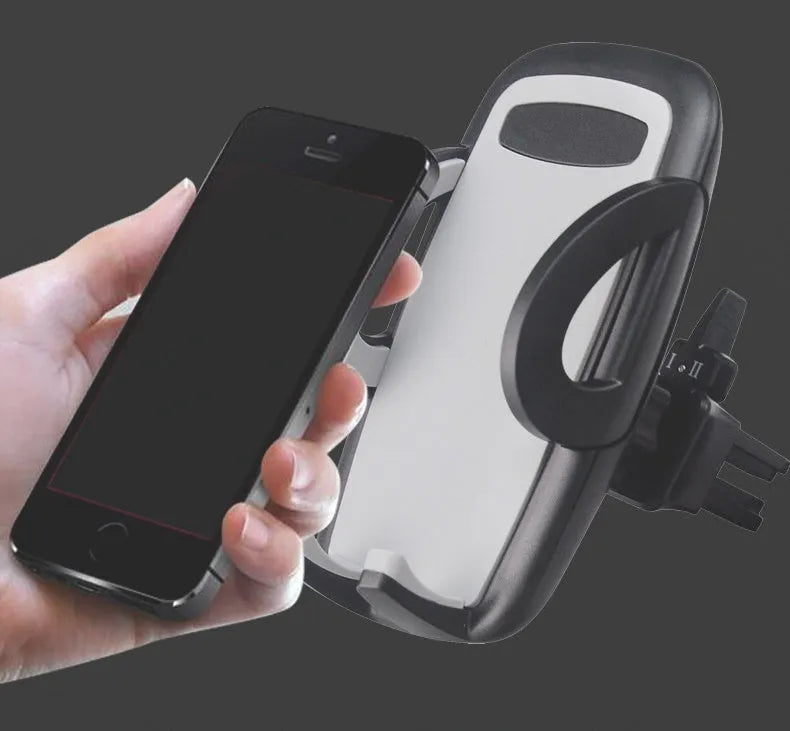Black universal car air vent mobile phone holder attached to a vehicle vent, showing adjustable arms and 360-degree rotation.