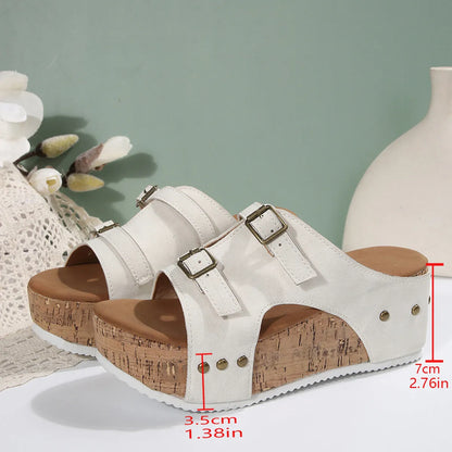 Women's platform muffin beach sandals in black, showcasing scaffold fish mouth design and PU upper.