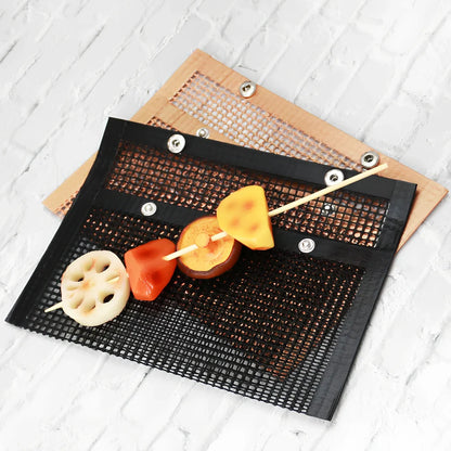 Black grill mesh bag with non-stick grid mat for BBQ cooking showing smoke-through design