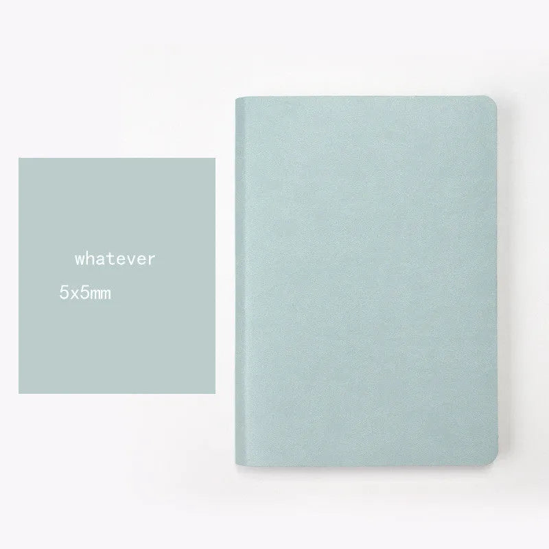 Blue soft imitation leather A5 dotted notebook open on dot grid pages.