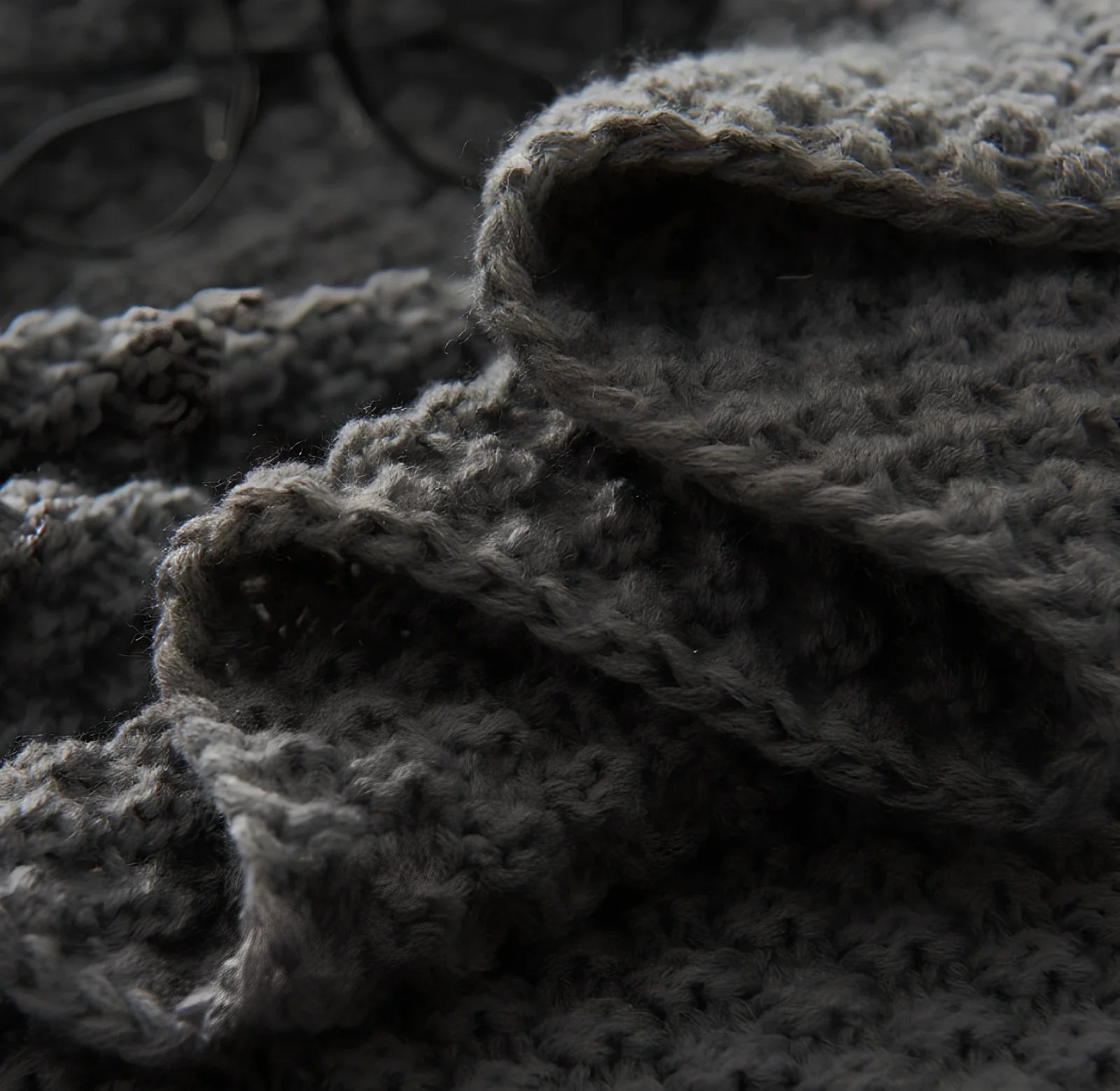 Fringed knitting blanket in beige colour showing 5cm fringe detailing and dense acrylic weave texture