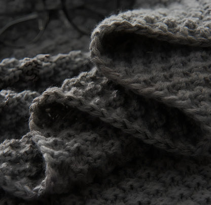 Fringed knitting blanket in beige colour showing 5cm fringe detailing and dense acrylic weave texture