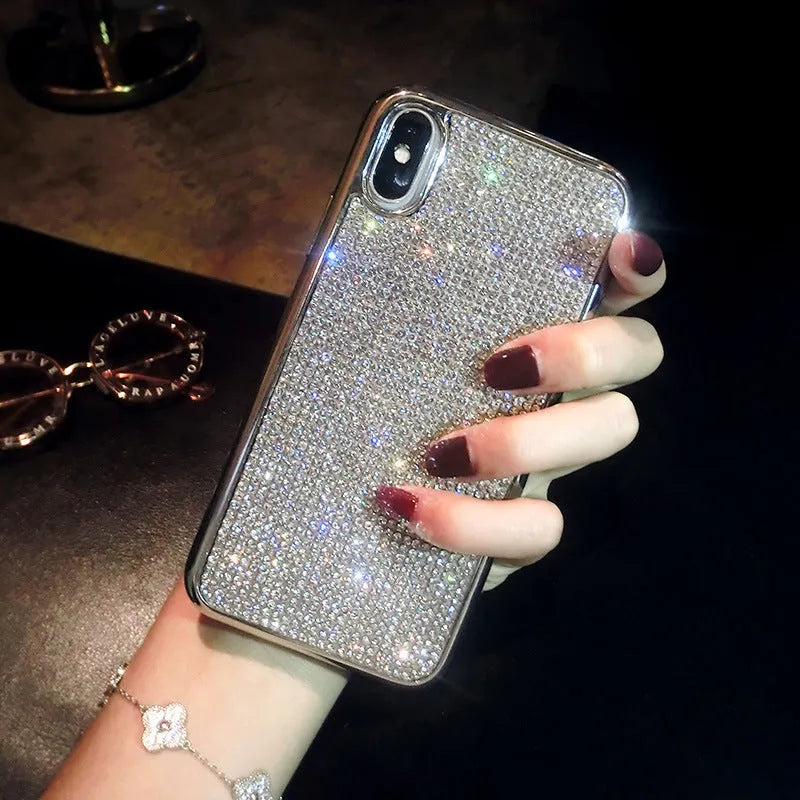 Silver full diamond silicone phone case for iPhone, showing camera and button cut-outs.