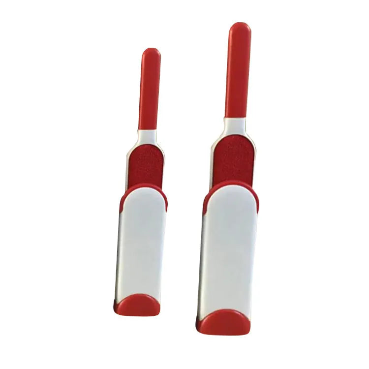 Blue reusable pet hair removal brush with double-sided head next to its self-cleaning base.