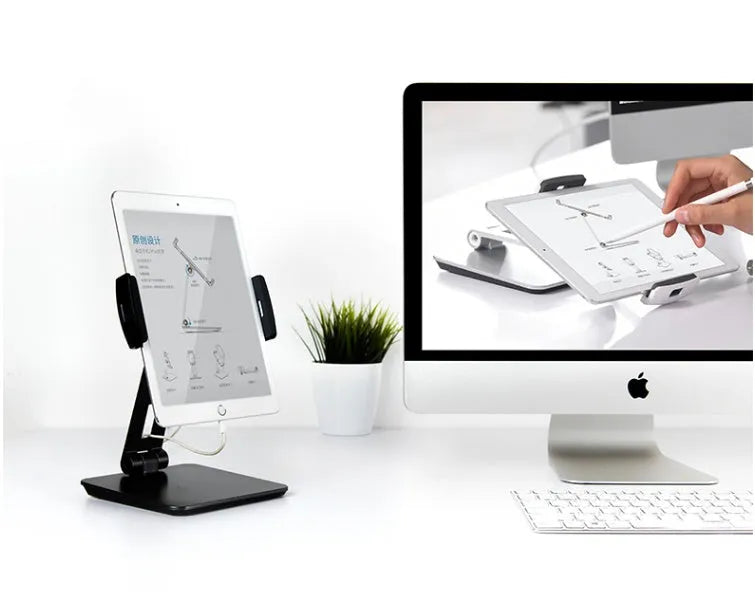 Silver folding phone and tablet stand holding a device, showing its 360-degree rotation and compact size