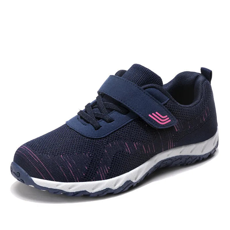 Women's gray purple casual shoes with mesh upper, wedge heel, and Velcro strap.