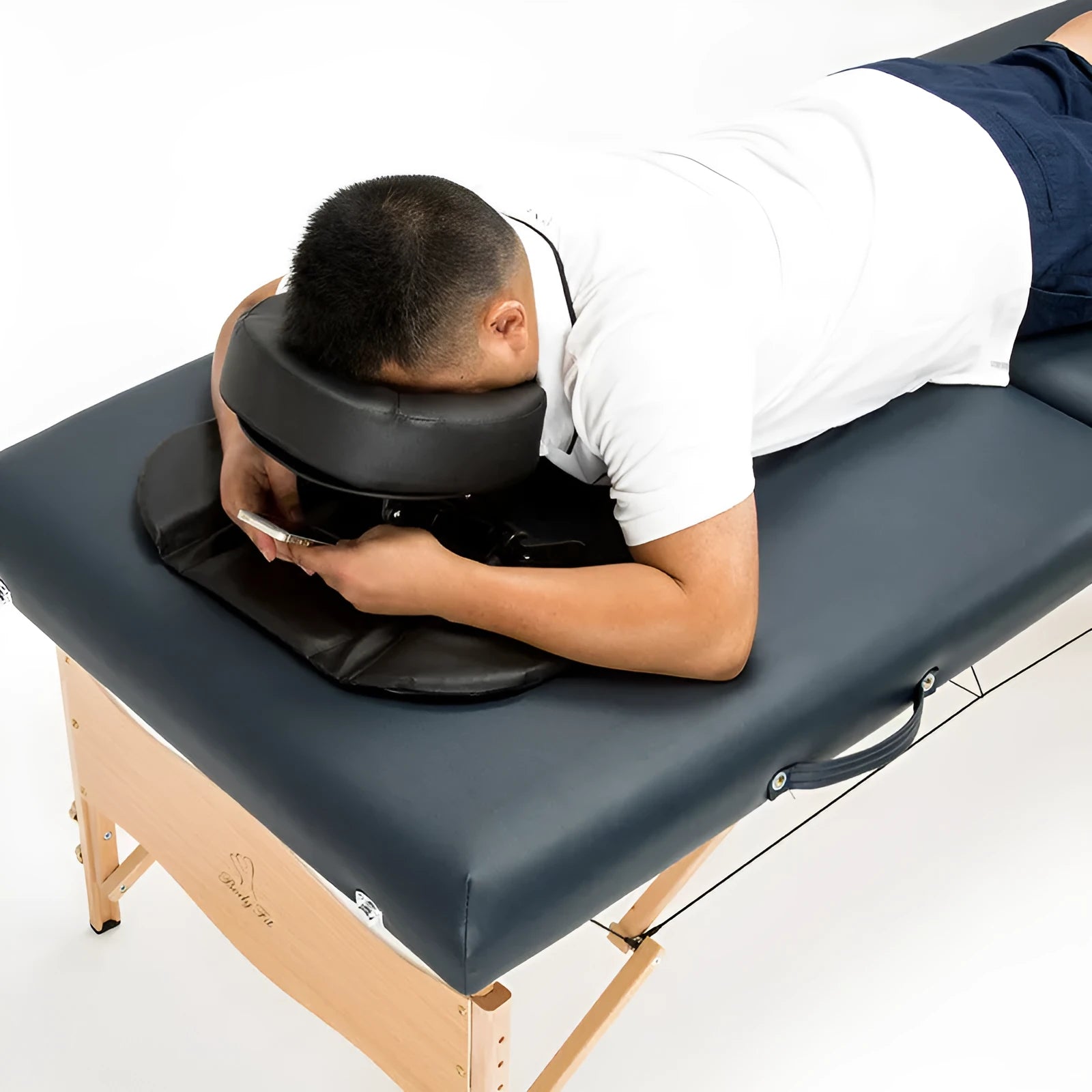 U-shaped black SPA facial massage pillow with adjustable height, shown with its zippered nylon carry case