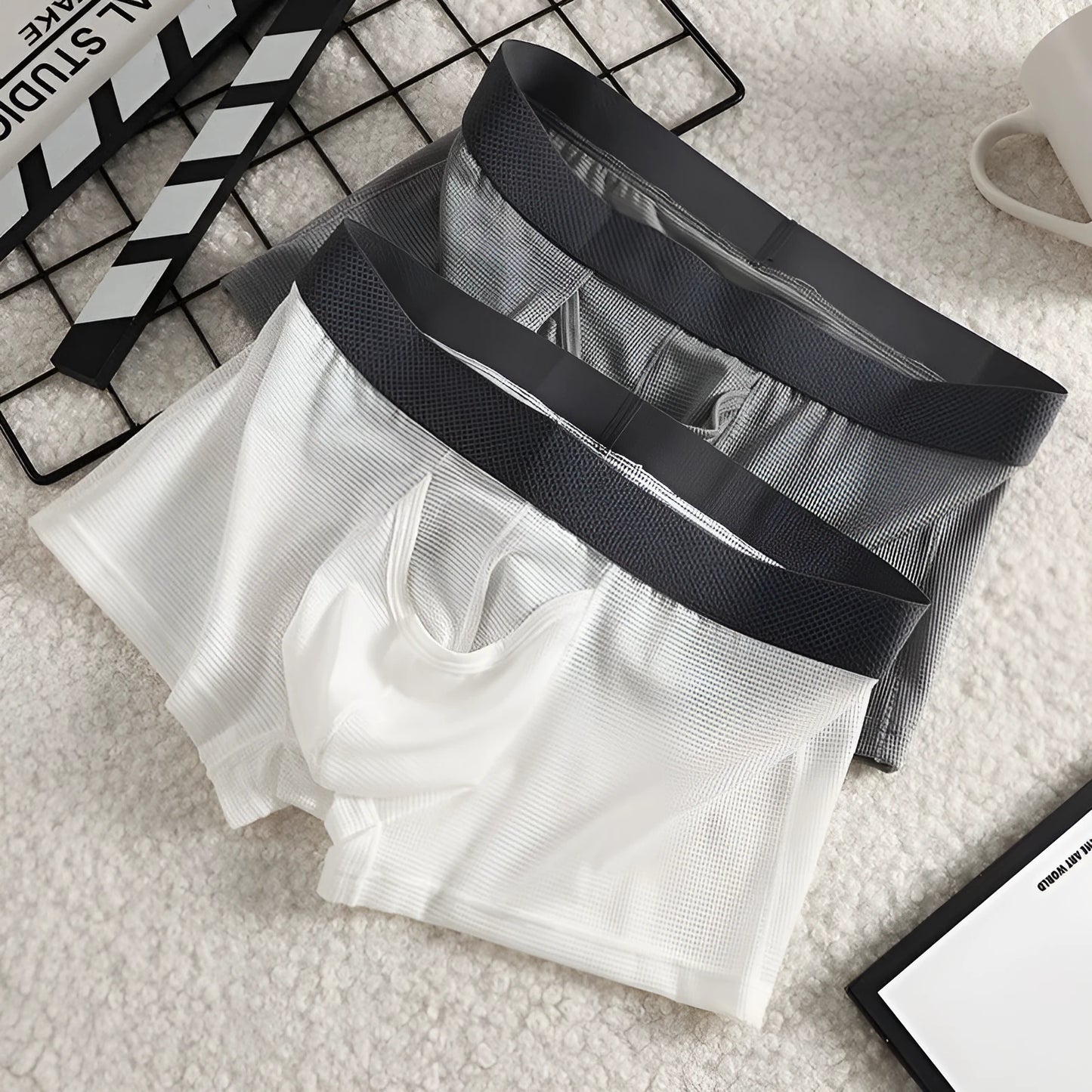 Men's ice silk boxer shorts in nylon mesh fabric showing low-waist design