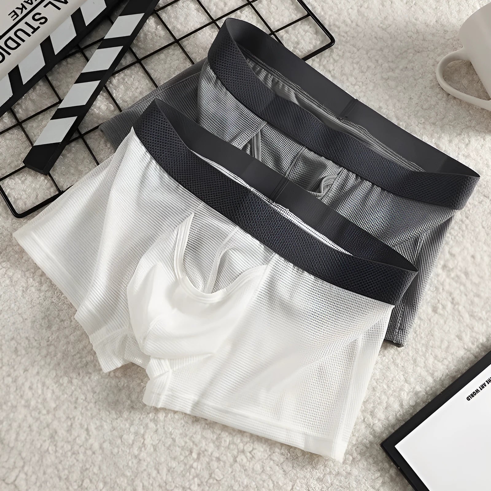 Men's ice silk boxer shorts in nylon mesh fabric showing low-waist design