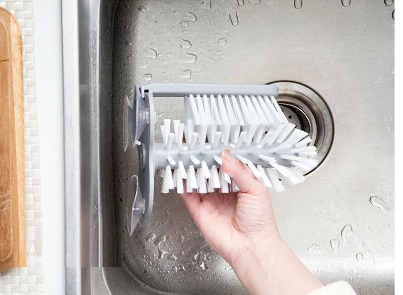 Grey suction cup brush with double-head design for cleaning cups and glasses