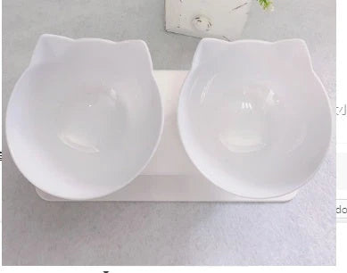Tilted cat and dog bowls with raised stand, designed to reduce neck strain and protect cervical vertebrae.