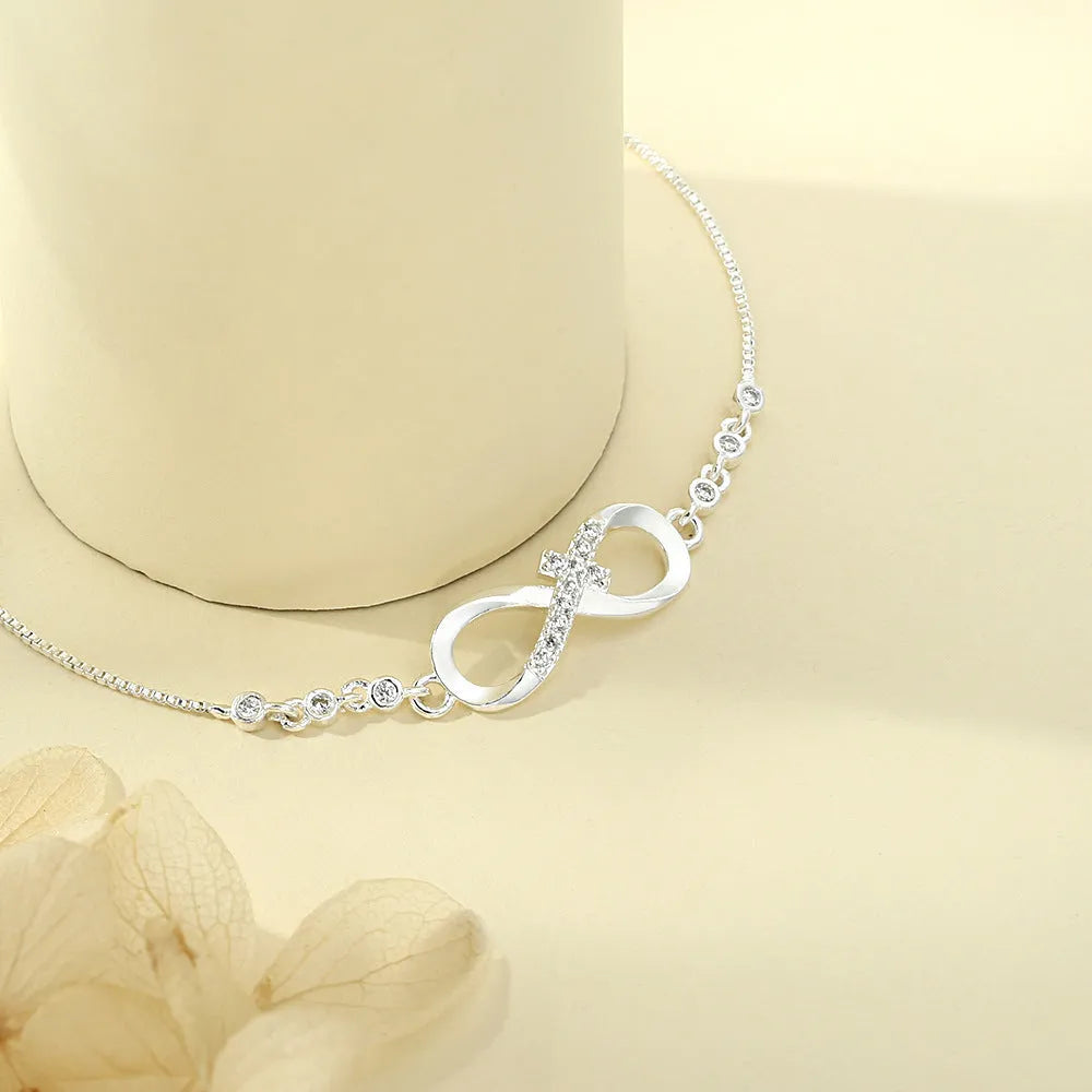 Diamond studded pull-out bracelet with infinite 8-shaped design, copper plastic, 26cm circumference, 20.0mm x 8.0mm