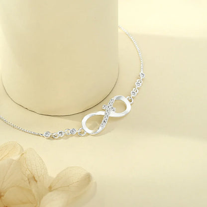 Diamond studded pull-out bracelet with infinite 8-shaped design, copper plastic, 26cm circumference, 20.0mm x 8.0mm