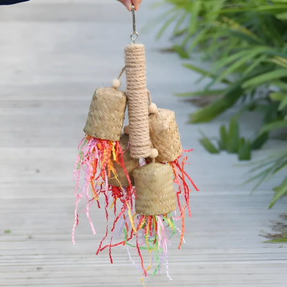 Natural wood and sisal rope shredded paper parrot activity toy measuring 15 by 35 centimetres.