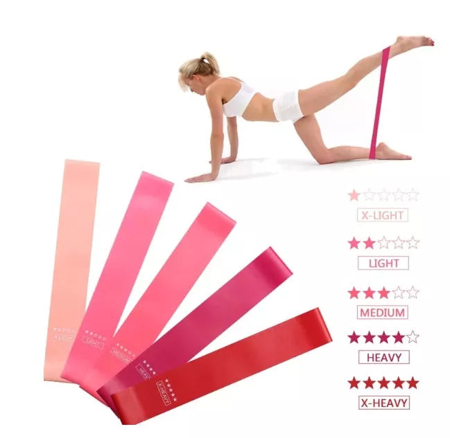 Yoga tension band set in five colours with varying resistance levels for fitness and Pilates