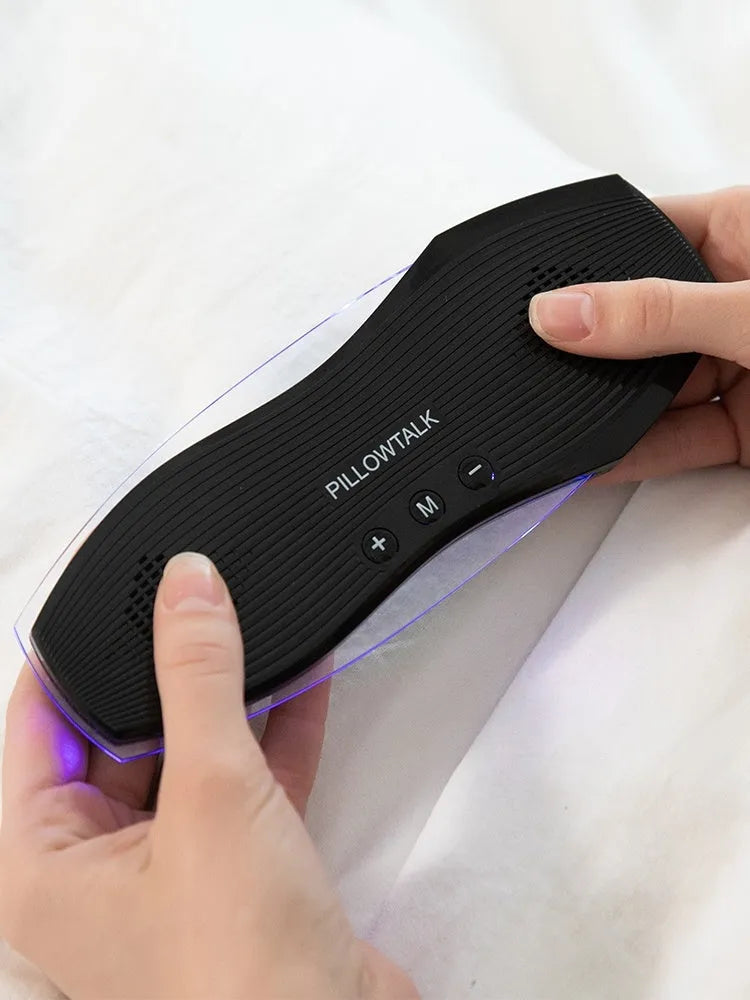Black wireless in-ear headphones with USB charging case showing Bluetooth connectivity